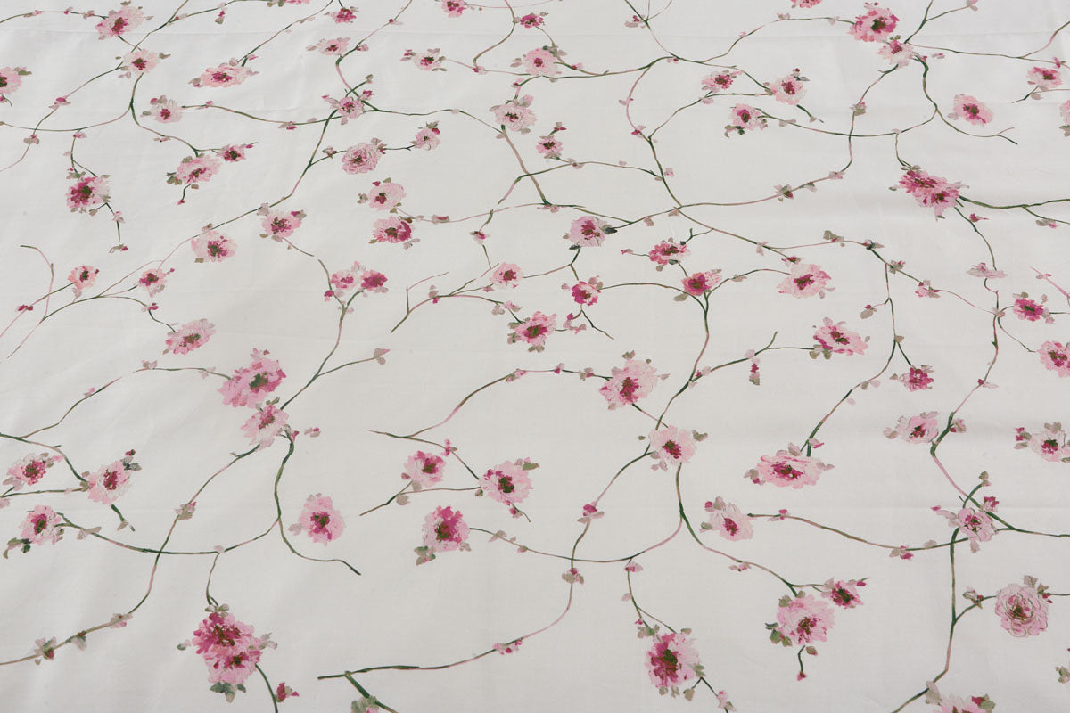 Floral pattern with pink flowers and branches on a light background